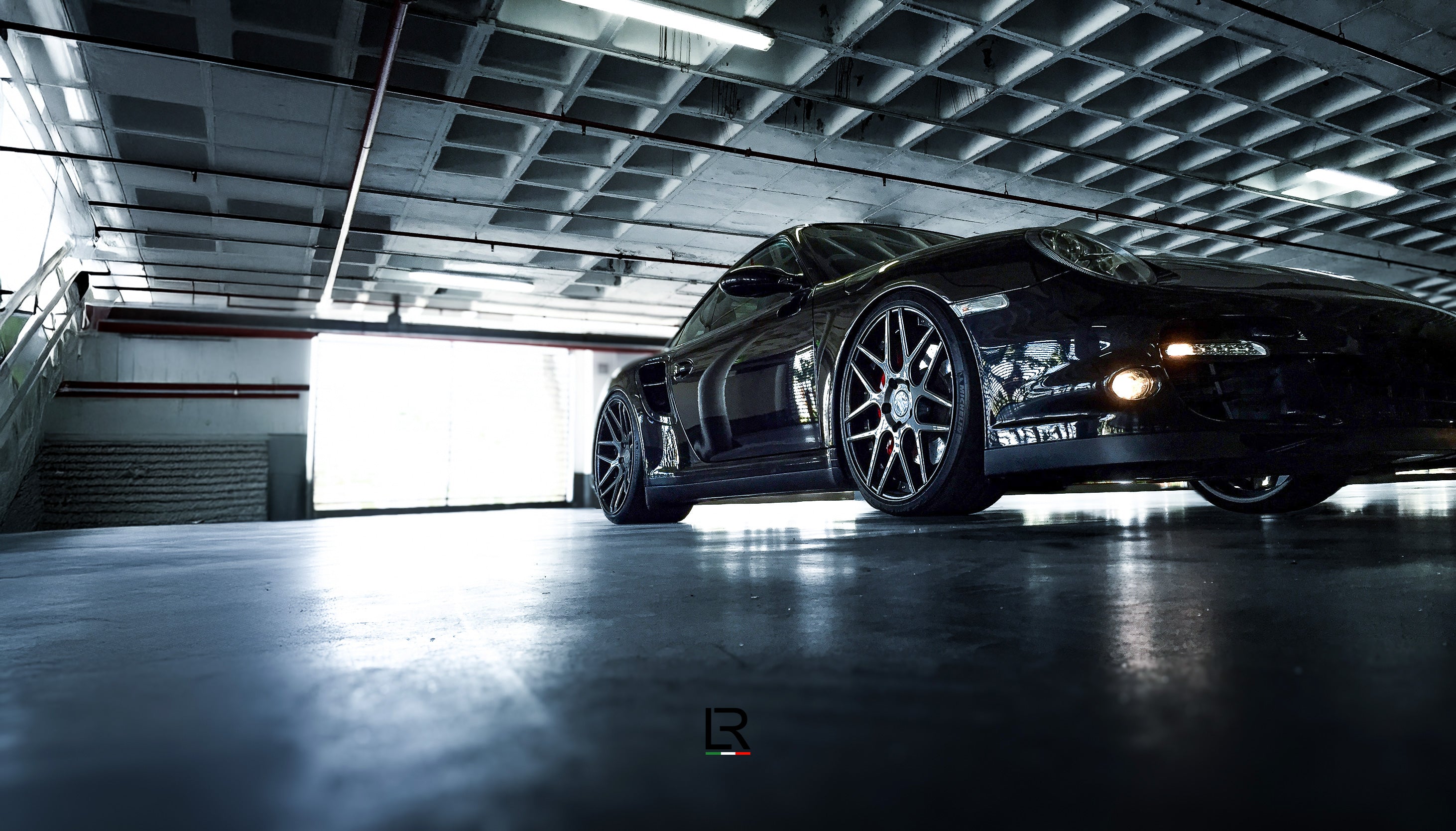 LOMA-Refined-Porsche-997-Turbo-S-tuning-front-side-view-showing-catless-downpipe-and-LF-88R-wheels.