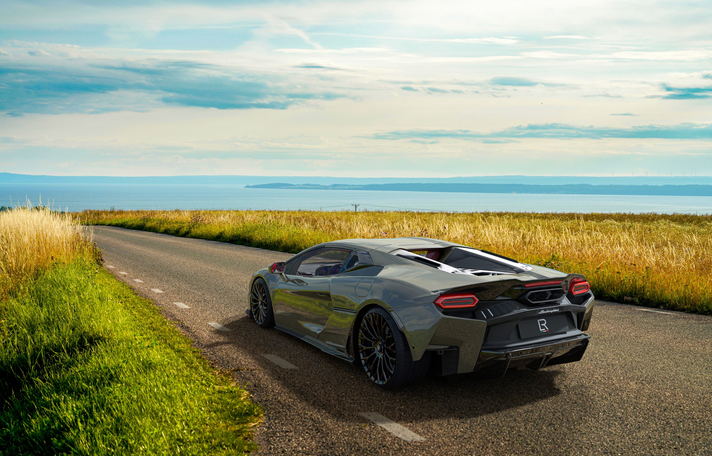 Lamborghini-Temerario-stanced-on-a-open-road-in-California-showcasing-cutom-forged-centerlock-rims-and-catless-downpipe.