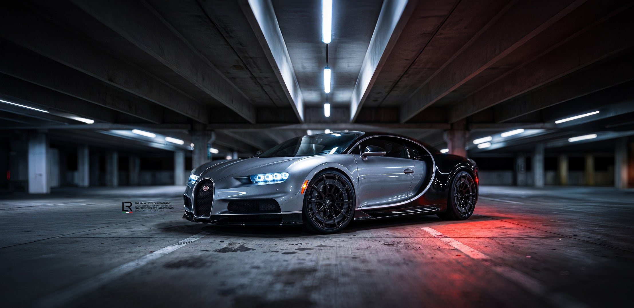 Low front angle of a custom Bugatti Chiron featuring aftermarket gloss black LOMA LF-99R forged wheels with carbon discs