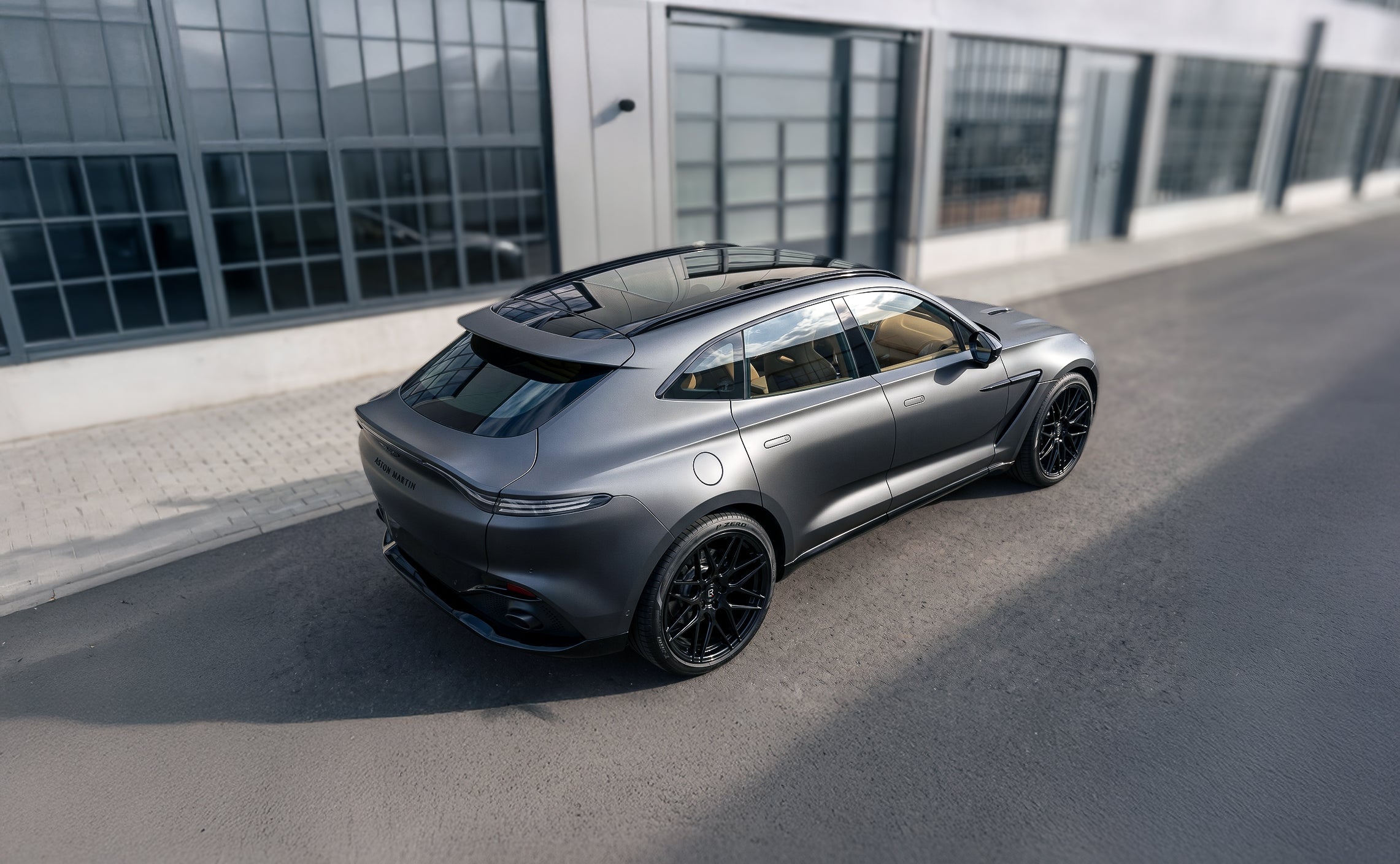 Custom Aston Martin DBX with LF-82R Forged Wheels by LOMA Refined tuning from a high angle rear side view.