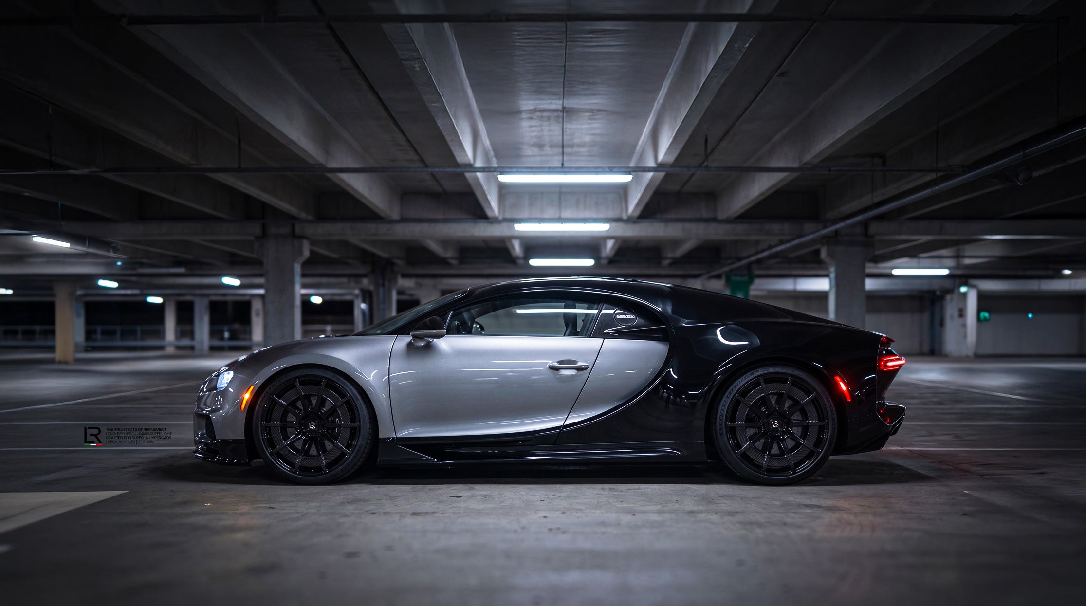Side profile of a Titanium Grey and Gloss Black Bugatti Chiron featuring custom LOMA LF-99R aftermarket wheels.