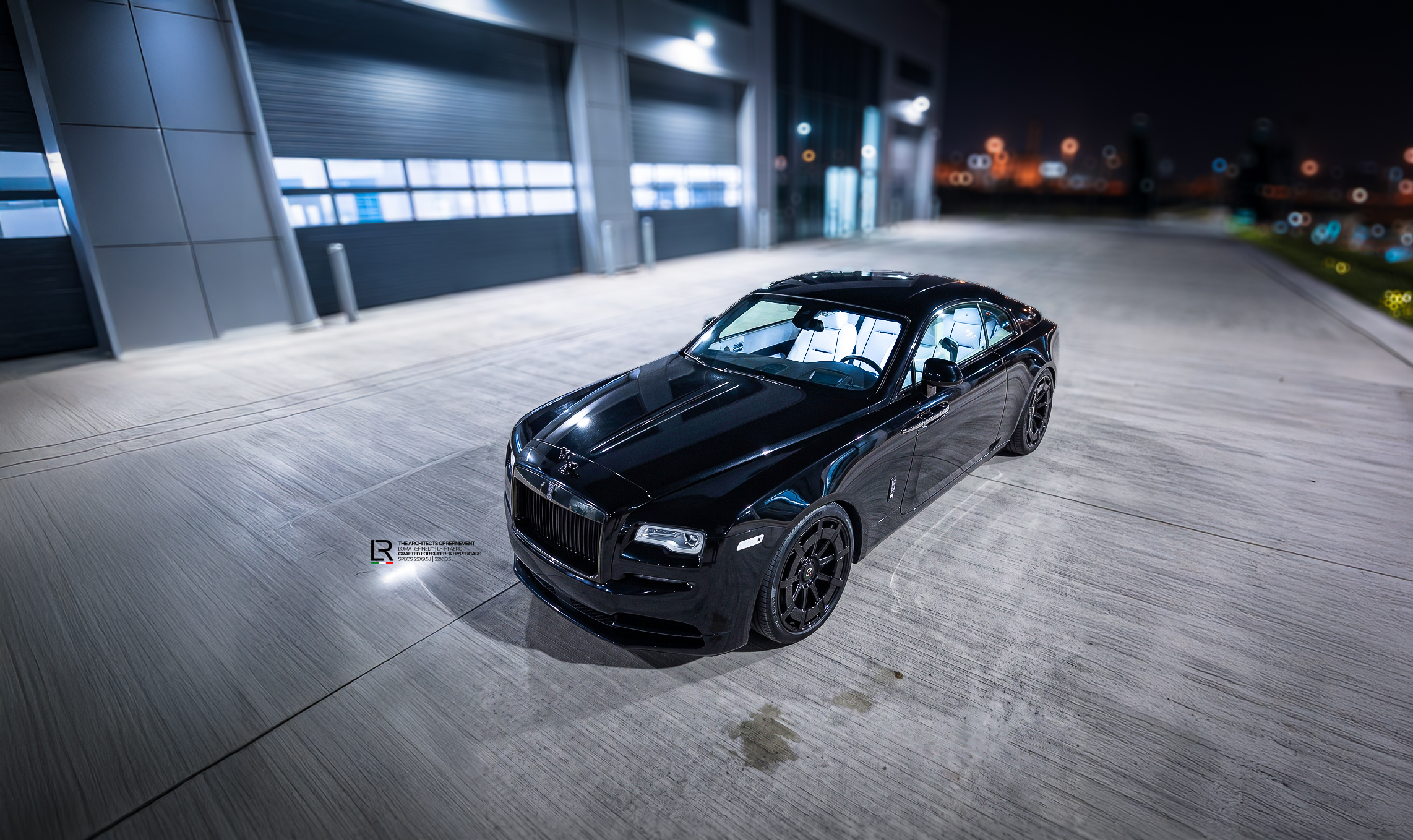 Custom Rolls-Royce Wraith Black Badge on LOMA Refined LF-F1 Aero 22-Inch wheels high angle front side view.